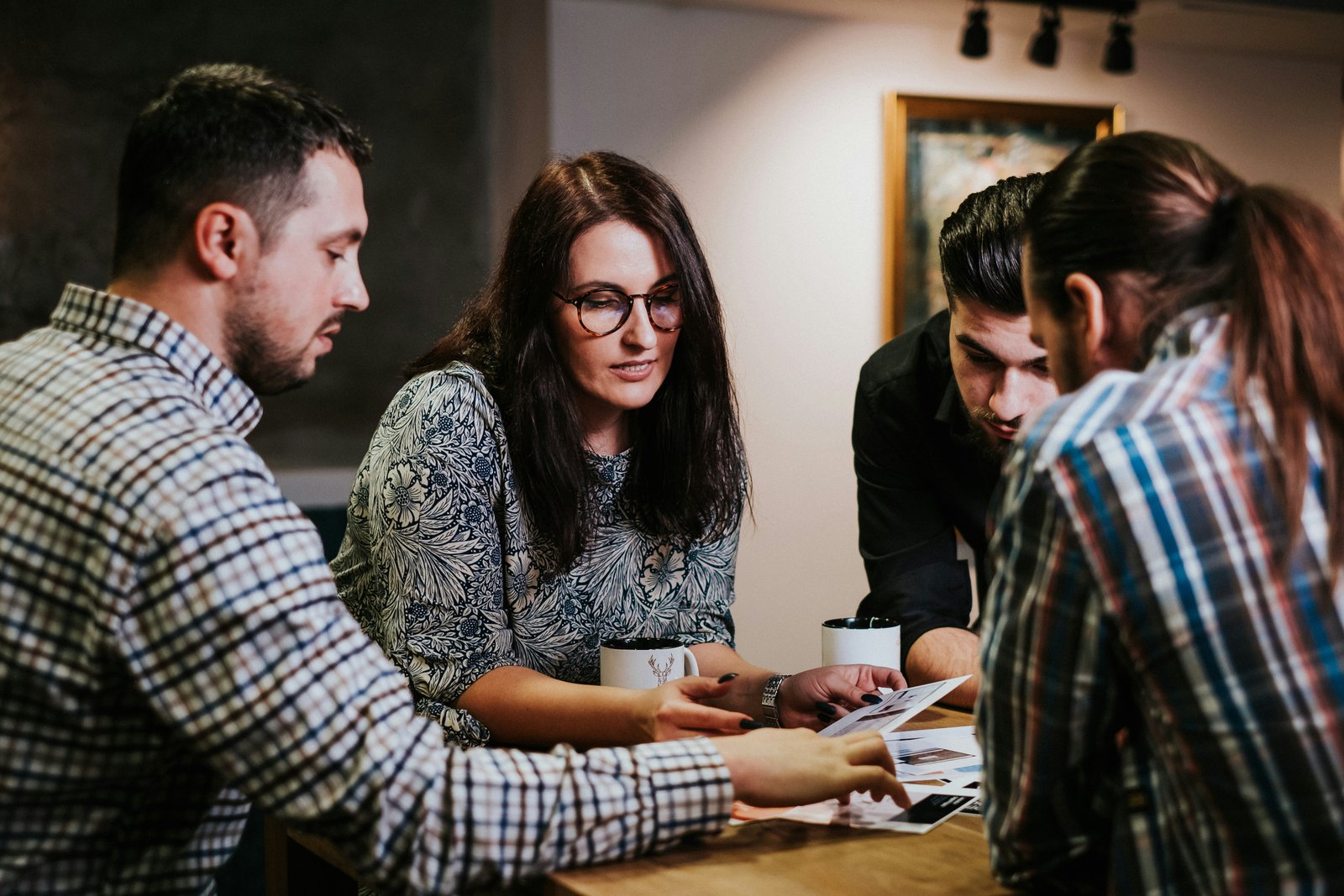 Business partners working together at a cafe using AI tools to grow their local Florida business